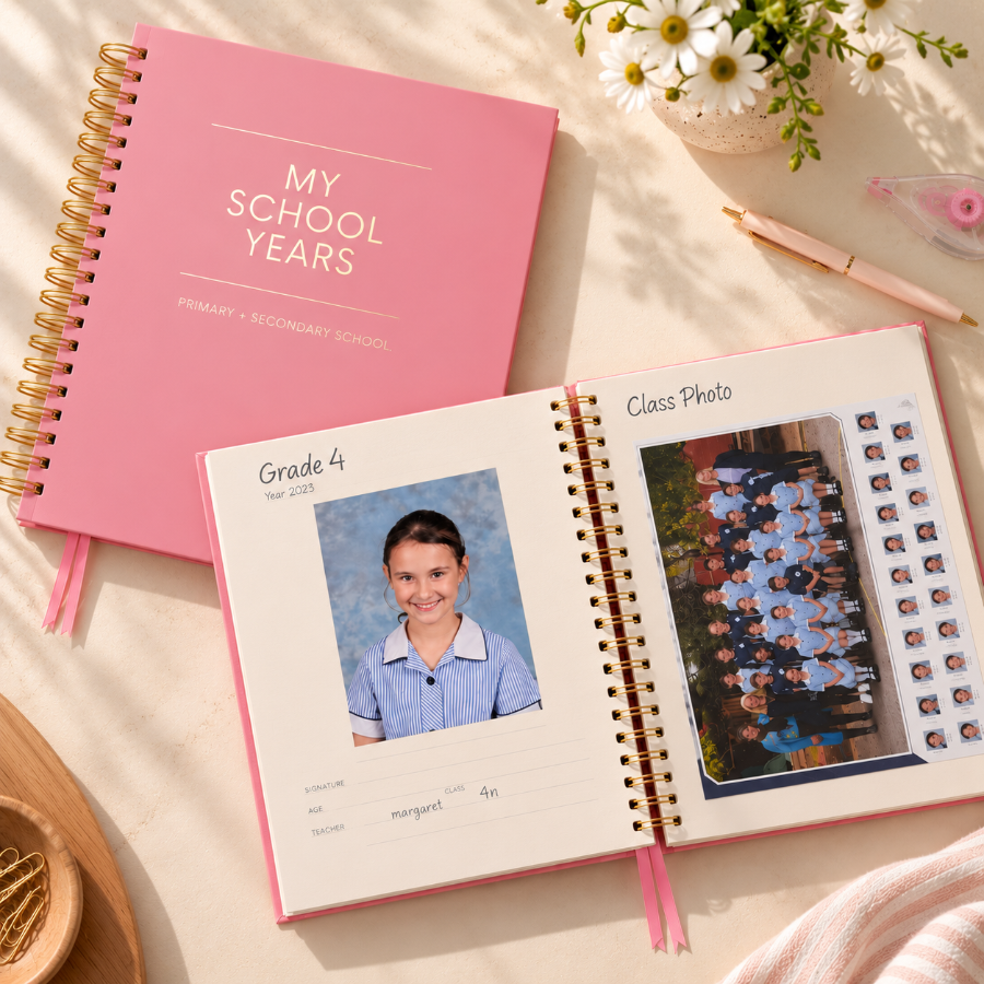 Luxe School Years Memory Book in pink, open to a Grade 4 school photo and class photo page