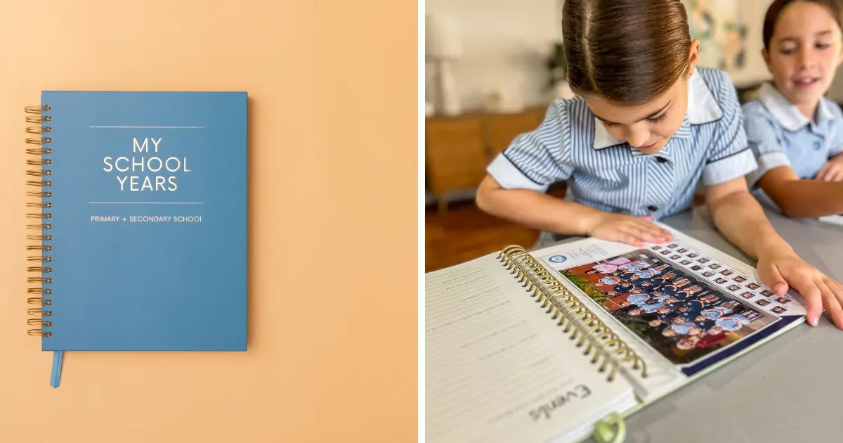 A premium spiral-bound school memory journal with champagne gold (#d4af37) accents lying open on a white wooden kitchen co...